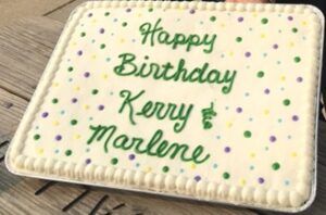Sheet cake reading Happy birthday Kerry & Marlene